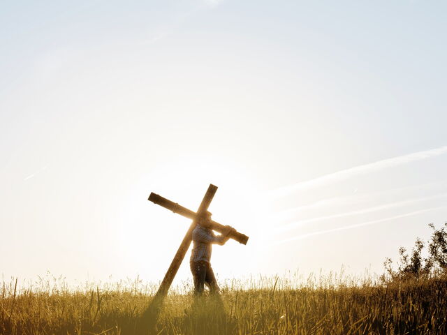 Carrying the crucifix